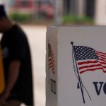 A person casts their vote during the early voting process at a voting station ahead of the upcoming 2024 U.S. presidential election on October 27, 2024 in Los Angeles, California.