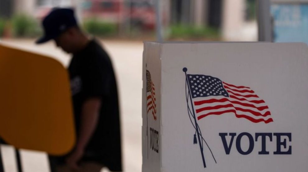 A person casts their vote during the early voting process at a voting station ahead of the upcoming 2024 U.S. presidential election on October 27, 2024 in Los Angeles, California.