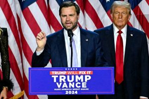 US Senator from Ohio and Republican vice presidential candidate JD Vance (C) speaks alongside former US President and Republican presidential candidate Donald Trump during an election night event at the West Palm Beach Convention Center in West Palm Beach, Florida, on November 6, 2024. Republican former president Donald Trump closed in on a new term in the White House early November 6, 2024, just needing a handful of electoral votes to defeat Democratic Vice President Kamala Harris. (Photo by Jim WATSON / AFP) (Photo by JIM WATSON/AFP via Getty Images)