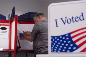 A voter with their ballot at a voting center at the Elena Bozeman Government Center in Arlington, Virginia, on September 20, 2024 during early in-person voting.