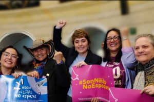 Activists celebrate the elimination of child marriage in the Colombian Parliament.