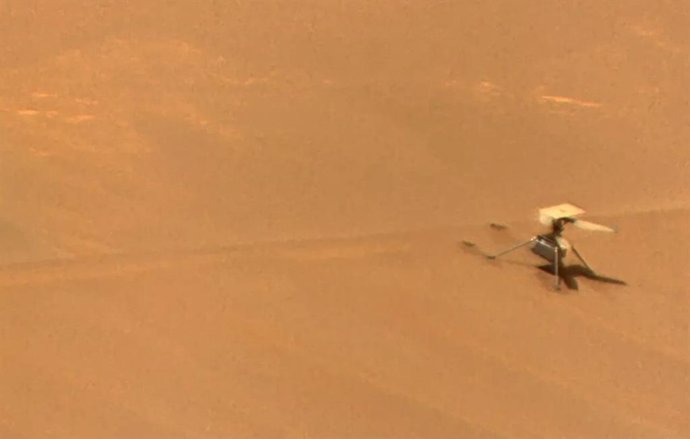 NASA's Ingenuity Mars helicopter, right, sits near the apex of a sand ripple in an image taken by Perseverance on February 24, 2024, about five weeks after the helicopter's final flight.