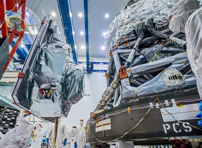 Technicians install the main instrument on NASA's Nancy Grace Roman Space Telescope, called the Wide Field Instrument (at left),