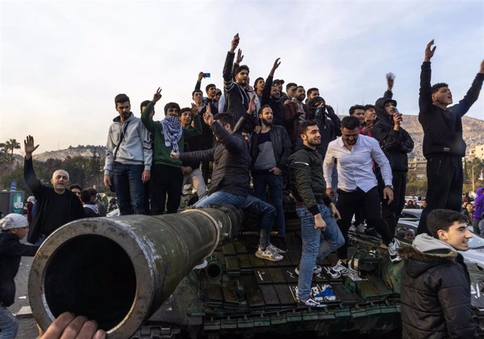 Syrians celebrate the fall of the regime of Syrian President Bashar al Assad