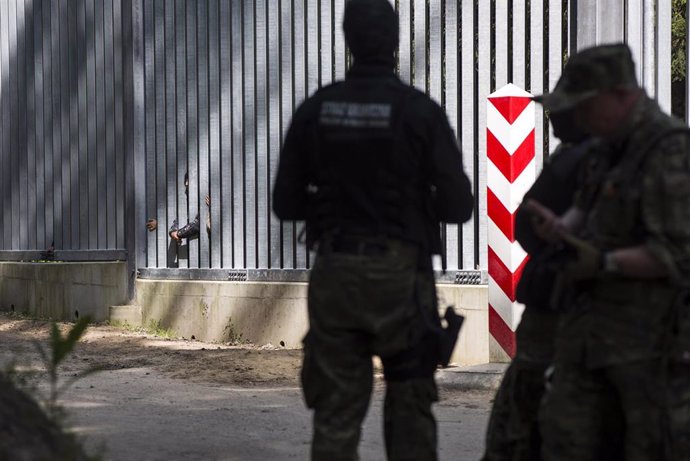 File - Archive image of Polish security forces on the border with Belarus