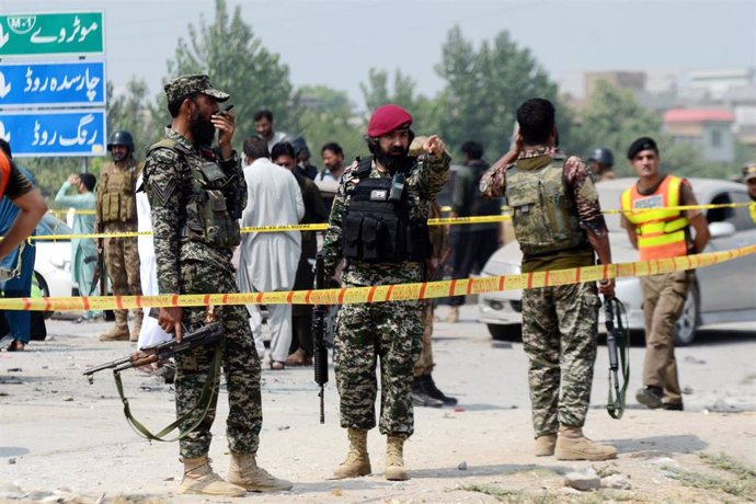 File - September 11, 2023, Peshawar, Peshawar, Pakistan: Pakistani security officials inspect the scene of an explosion targeting a vehicle of paramilitary frontier corps in Peshawar, Pakistan, 11 September 2023. At least one Frontier Corps official wa