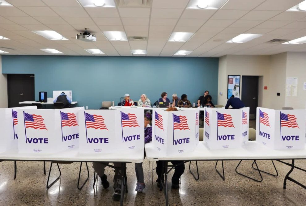 People vote in the 2024 US presidential election on Election Day in Grand Rapids, Michigan, on November 5. (Photo: Carlos Osorio/Reuters).