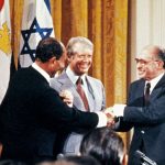 Egyptian President Anwar al-Sadat (left), Israeli Prime Minister Menachem Begin (right) and US President Jimmy Carter (center). CONSOLIDATED NEWS/AFP via Getty Images)