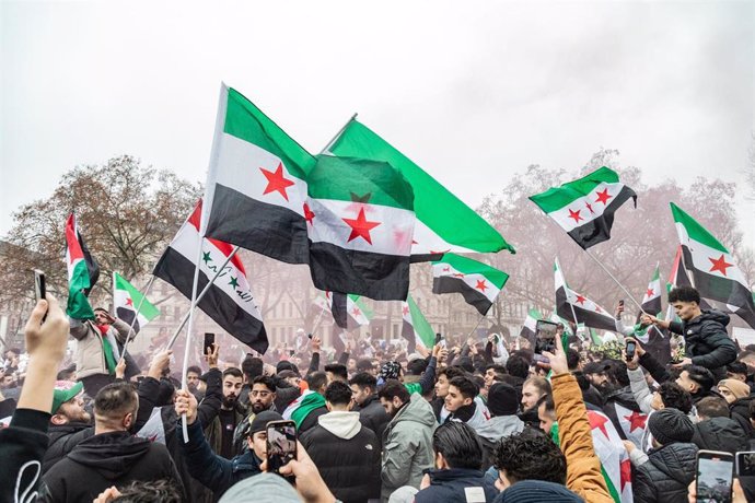 Syrian protesters in Berlin celebrating the fall of the Assad regime