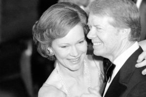 President Jimmy Carter and his wife Rosalynn lead guests at the annual Congressional Christmas Ball at the White House in December 1978.