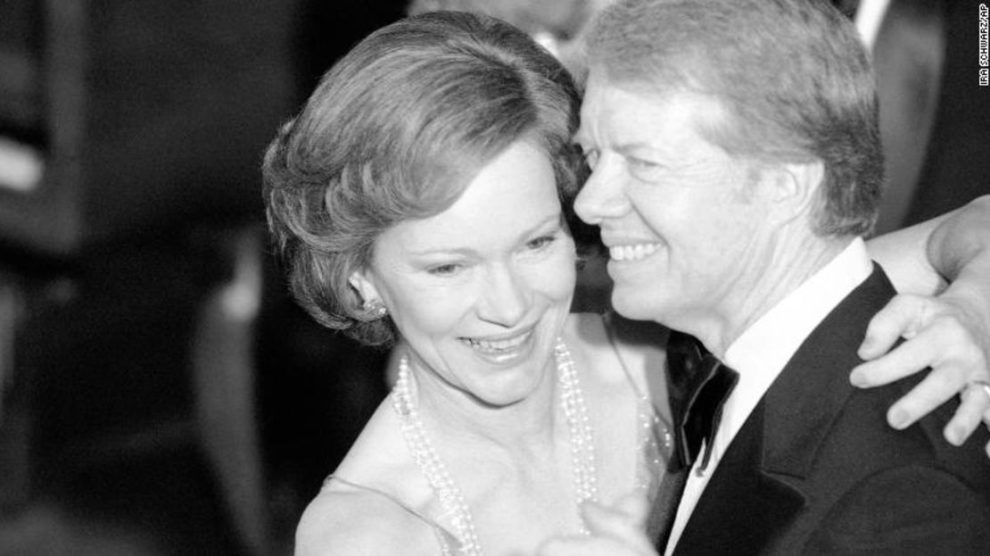 President Jimmy Carter and his wife Rosalynn lead guests at the annual Congressional Christmas Ball at the White House in December 1978.