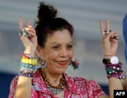 FILE - Nicaraguan Vice President Rosario Murillo makes the V sign during a rally commemorating the 40th anniversary of the takeover of the National Palace by Sandinista guerrillas before the triumph of the revolution, in Managua on August 22, 2018.