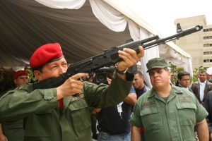 Venezuelan President Hugo Chavez aims a Russian-made AK-103 assault rifle on June 14, 2006 during a ceremony at the Ministry of Defense in Caracas.