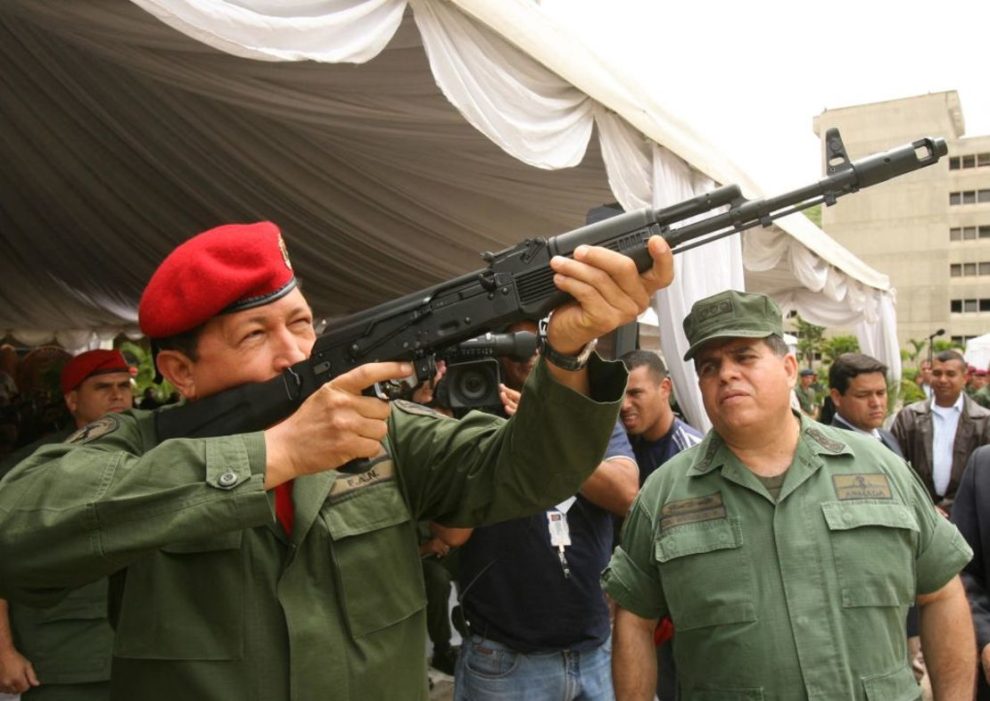 Venezuelan President Hugo Chavez aims a Russian-made AK-103 assault rifle on June 14, 2006 during a ceremony at the Ministry of Defense in Caracas.