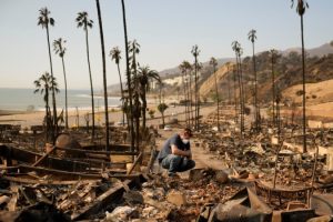 Fire deaths rise in Los Angeles as crews try to save homes and other buildings