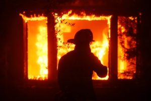 Fire in Los Angeles destroys dozens of residences and forces the evacuation of about 30,000 people