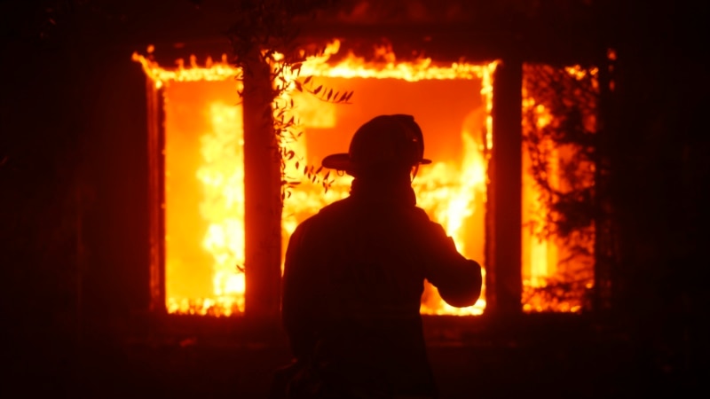 Fire in Los Angeles destroys dozens of residences and forces the evacuation of about 30,000 people