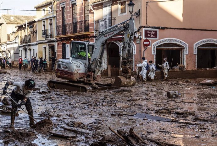 File - An excavator on a street in Paiporta, on November 6, 2024, after the passage of the Dana