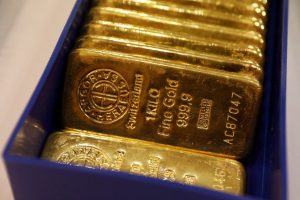 Gold rises to more than two-week highs on safe haven demand