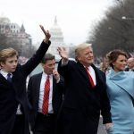 Donald Trump and his family walk down Pennsylvania Avenue to the White House